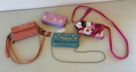 * Four brand new clutch purse wallets. $20 takes all of them!