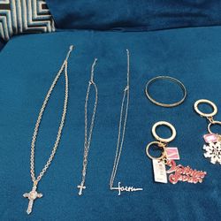 Four Necklace with crucifix, bracelet , and two elegant keychains