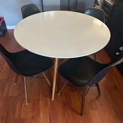 Dining table with 4 eames style chairs