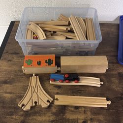 Box of Brio train play set pieces