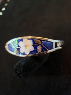 $15. Alpaca Mexico dark blue enamel bracelet with inlaid mother of pearl and abalone shell. Fits wrist up to 7.5 in. NOT STERLING.