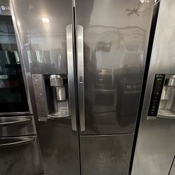 Used Black Stainless Steel LG Side By Side Refrigerator In Excellent Condition!