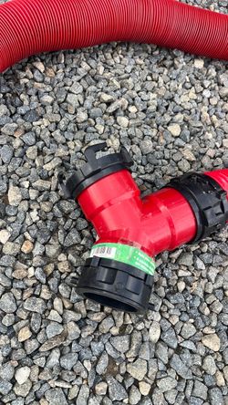 Red and black camping hose for gray water and sewer drainage