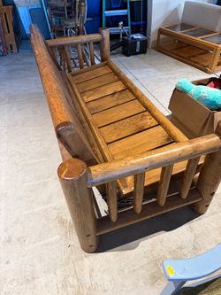 Log futon with red futon mattress