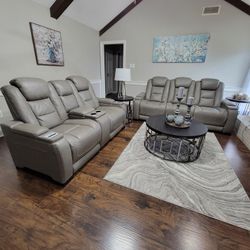 Color Is Gray & Is Made From Leather. Electric Couches, Wireless Charging, 3 Living Room Tables, And Cuholders 