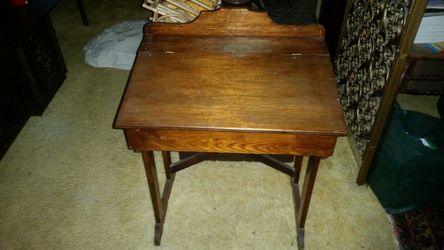 Antique children's wooden desk that opens
