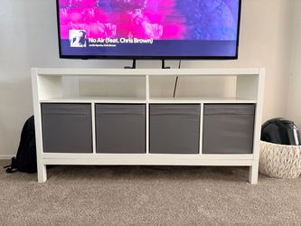 IKEA tv stand with 4 gray storage boxes
