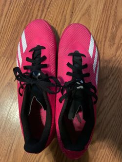 Pink n black Reebok cleats size 7