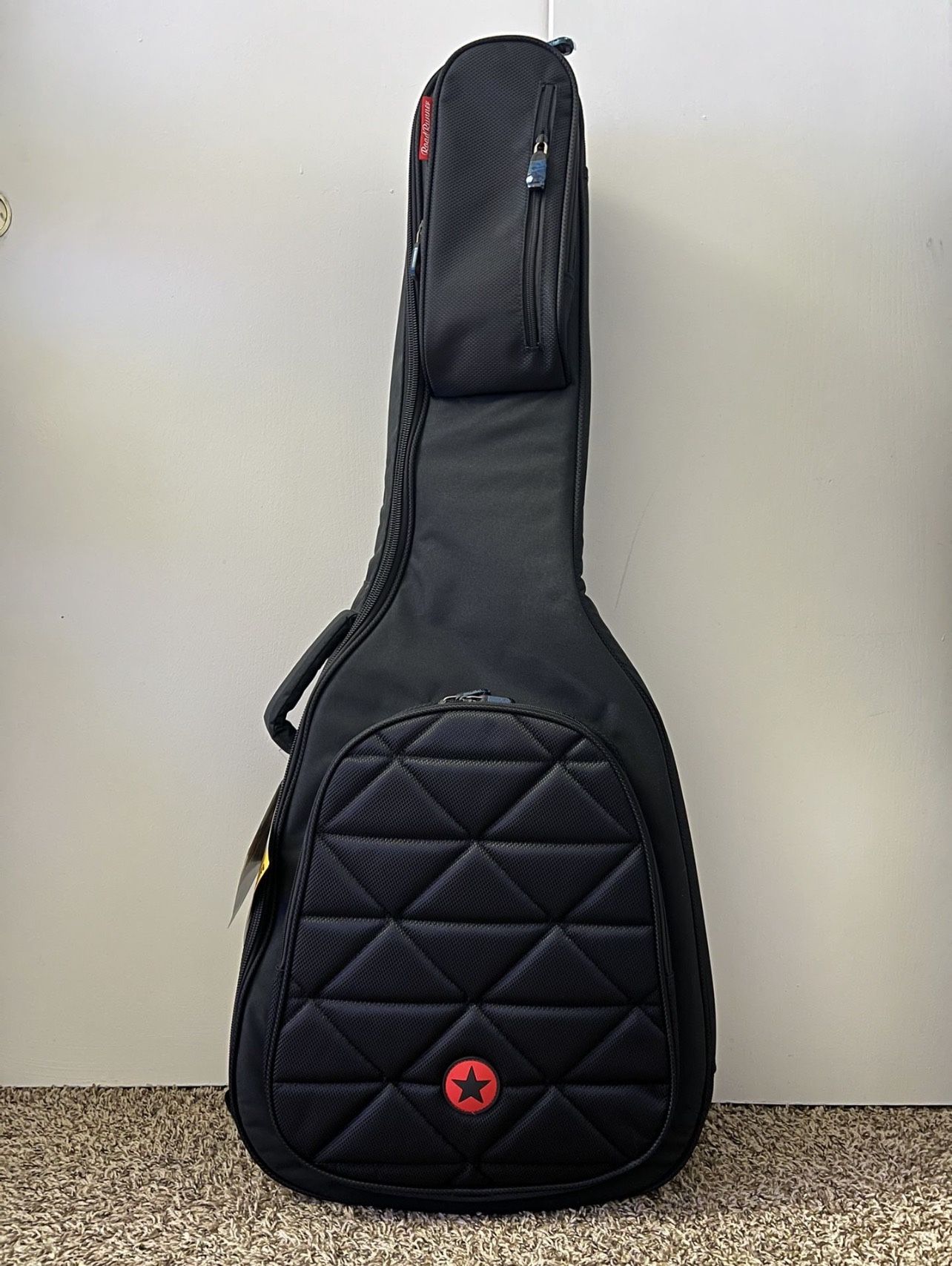 Guitar Bag with Tag and Covered with Plastic Bag