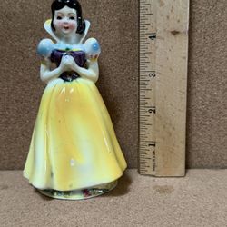 vintage porcelain figurine of Snow White, identified as likely being manufactured in Japan during the 1960s