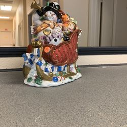 Snowman On Its Sleigh