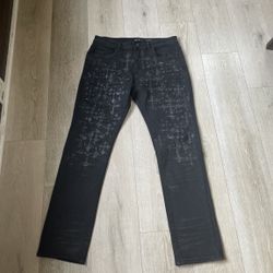 Premium black designer denim jeans with custom detailing
