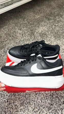 Black Nike platform shoes