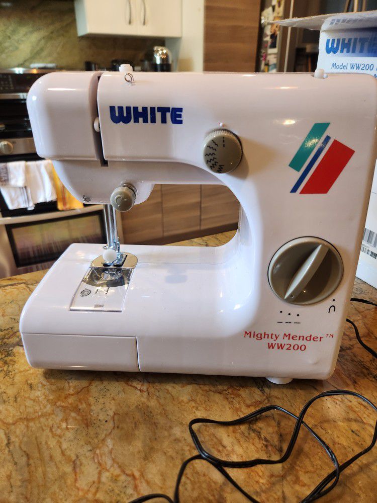 White Mighty Mender W200 Portable Sewing Machine .  
