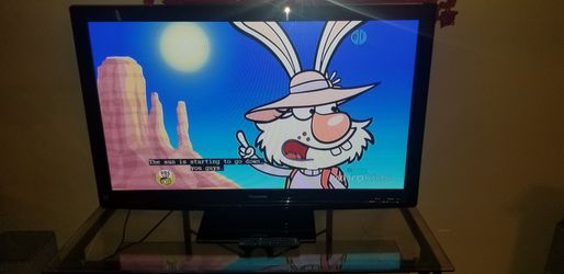 48 inch Panasonic flat screenTV with original remote on stand