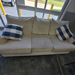 Large Beige 3-Seat Sofa Couch with 2 Plaid Throw Pillows – Comfortable & Stylish