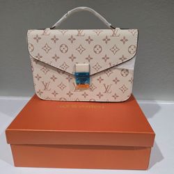 Pochette Métis in Monogram Dune designer bag