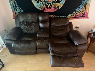 Electric reclining leather couch.
