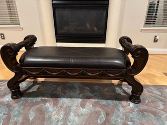 Ornate Dark Wood Bench with Brown Leather Seat