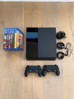 PS4 with 2 Controls and Games! (Great condition)