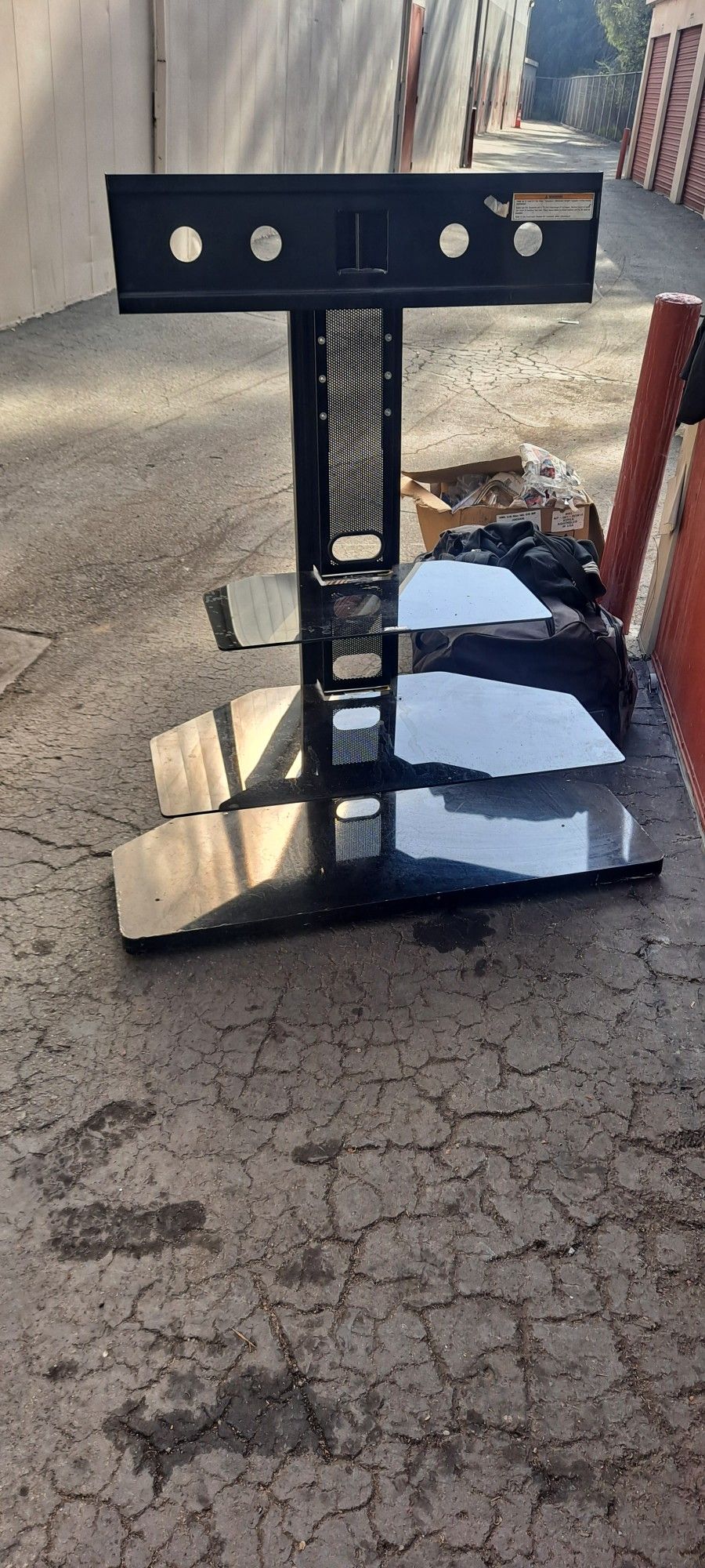 Nice swivel tv stand top 2 shelves glass bottom is wood laminate