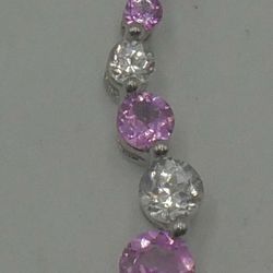 10KT WHITE GOLD PENDANT WITH WHITE AND PINK STONES 0.7 GRAMS MINT CONDITION. 858742-10. 
