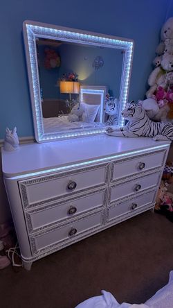 White dresser “Glitz” six-drawer with LED light-up mirror from  Bob’s Furniture – $199