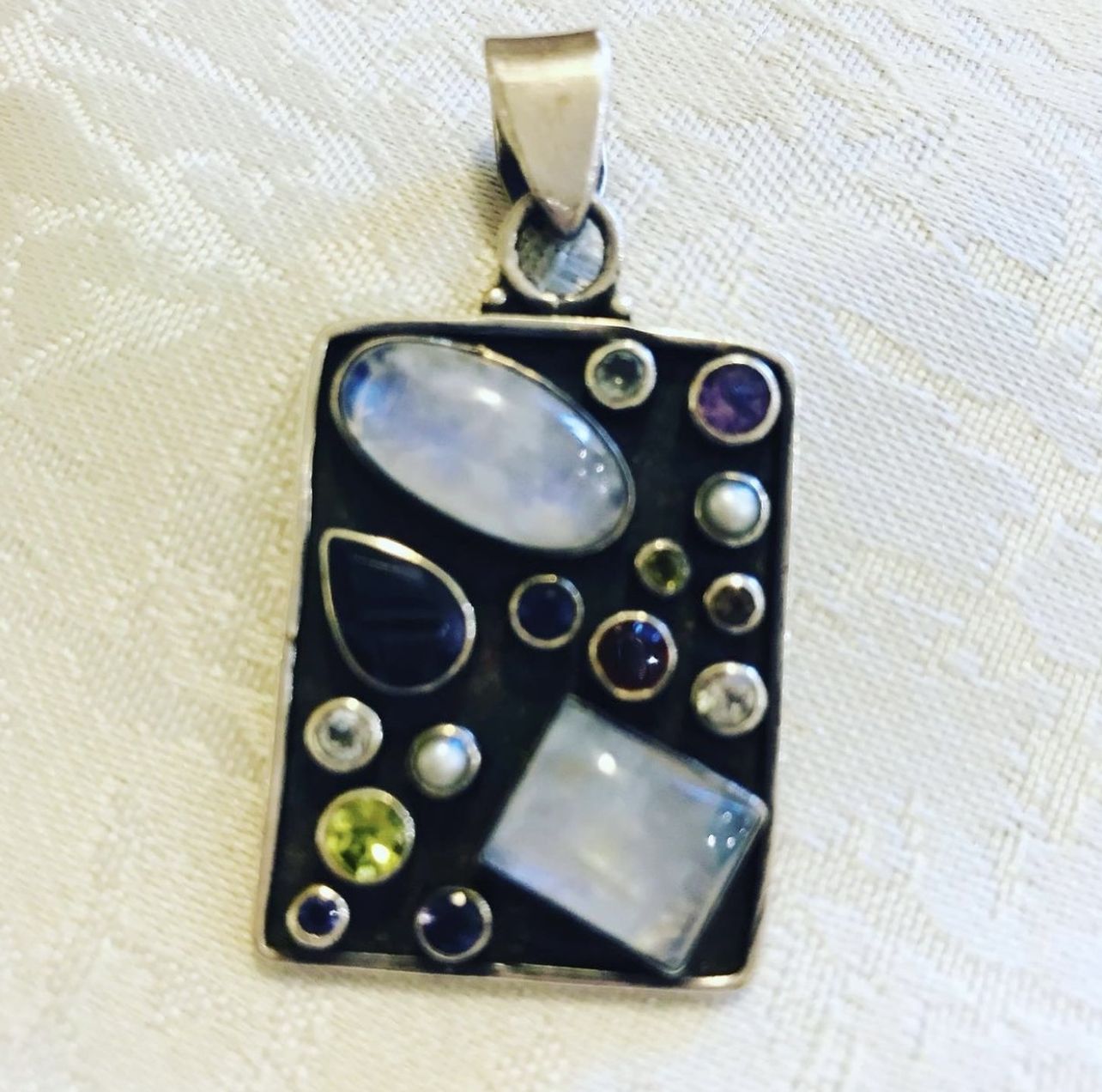 Sterling silver pendant with moonstone,peridot,amethyst and garnet