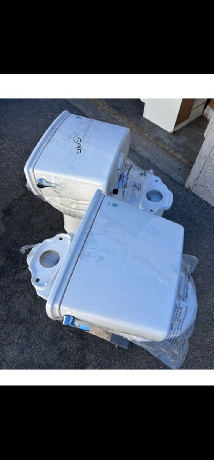 Brand new out of the box 2 piece ELONGATED TOTO TOILET WITH LEFT HAND LEVER SELLING EACH $180
