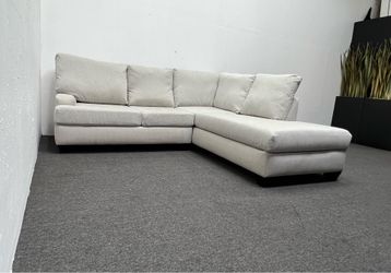 Living Spaces 2 pc Sectional couch with right arm facing corner Chaise. We deliver & setup.