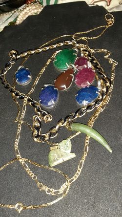 Numerous gold chains with pendants