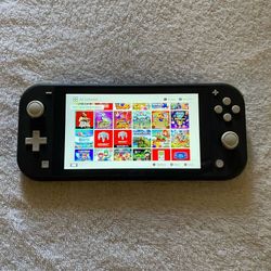 NINTENDO SWITCH LITE + 120 switch Games And 7500 Retro Classic Games