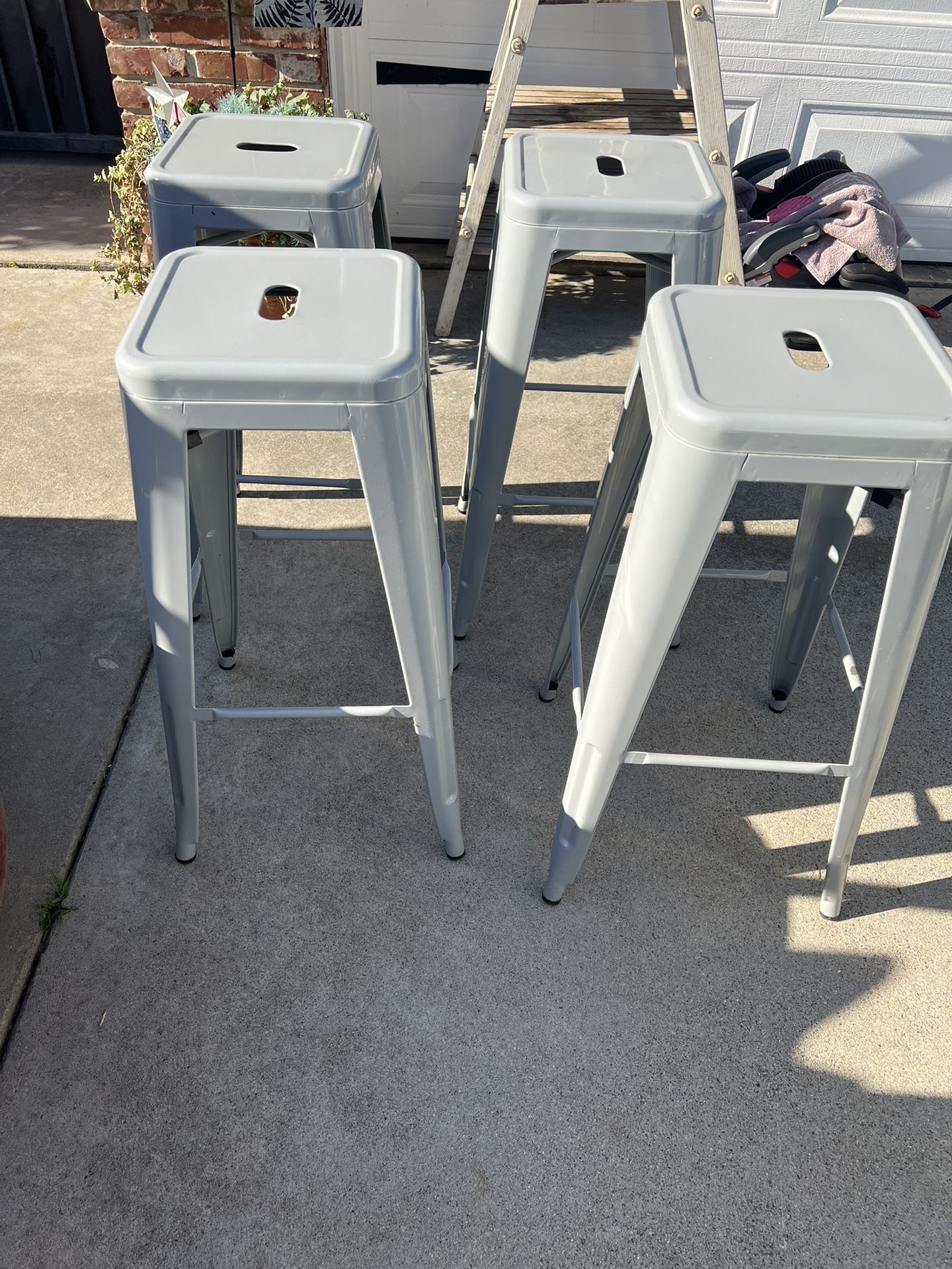 4 30” tall gun metal grey metal bar stools. 4/60$. one has minor blemish