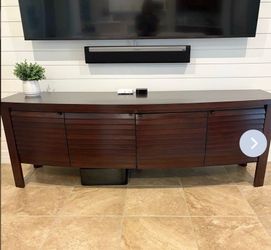 Contemporary  wooden TV console with 4 storage cabinets.