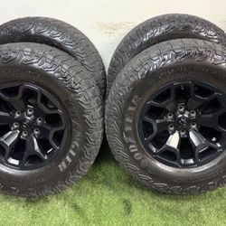 18 inch trx wheels with good year tires 6 lug ram and gm bolt pattern LT325/65r18 tire size same as a 35. 