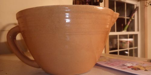 Large pottery mixing bowl with pour spout