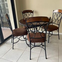 Beautiful Cloth And Wooden Table With Four Chairs