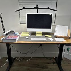 55inch width electric standing desk adjustable wooden desk. In great condition