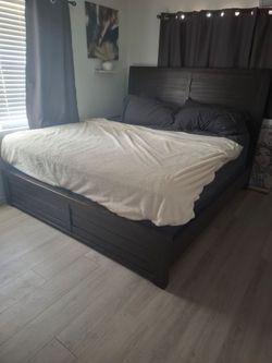 Dark Wood King Bed Frame with Box Springs and King size mattress.