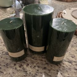 Three pillar candles, (2) 6 inches high and 3 inches Dia. Large one is 7 inches and 4 Dia. All 15.00