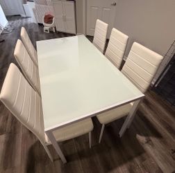 White Metal and Glass dining table set.