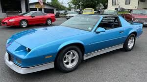 82-92 Chevy Camaro. Rear side speaker grills. Covers . Brown .