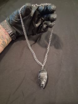 Stainless steel chain with tourmalinated quarts pendulum style pendant.
