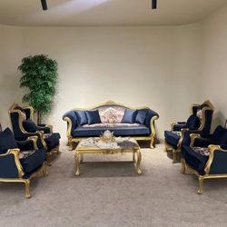 Curio Baroque Sofa Set LOOK UP A luxury Baroque-style navy blue velvet sofa and armchair set with gold trim. TIME PERIOD 21st Century Reproduction ORI