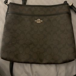 Brown and black coach crossbody bag