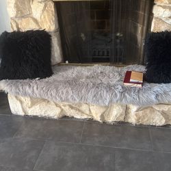 Two Black Pillow With The Rug