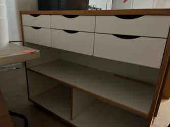 Art storage supply cabinet and work desks.