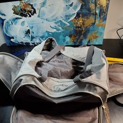 Grey Puma Pro Cat gym/duffle/athletic bag W 2 TEARS. Medium sized., can easily fit a full-size basketball or soccer ball inside. Has shoe pocket with 