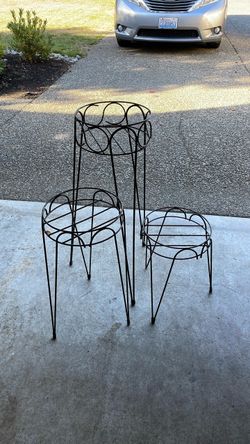 3 black metal plant stands