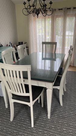 Brand new dining room set with custom glass top.